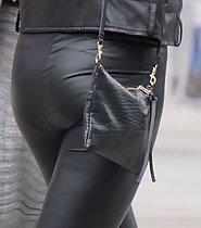 Seductive lady in tight leather pants