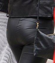 Seductive lady in tight leather pants