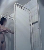 Cute woman showering