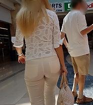 Blond girl sexy in all white clothes
