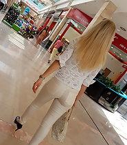 Blond girl sexy in all white clothes
