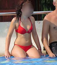 Sexy redhead at the swimming pool