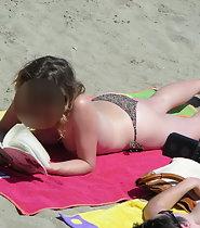 Topless girl reads a book