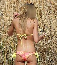 Young woman looks awesome in bikini
