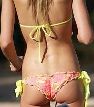 Young woman looks awesome in bikini