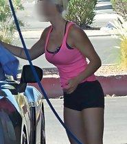 Busty girl washing cars