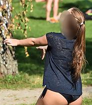 Hot teen plays volleyball in park
