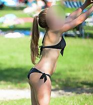 Hot teen plays volleyball in park