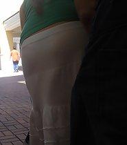 Thong pantyline through the skirt