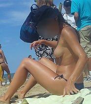 Beautiful topless girl at beach