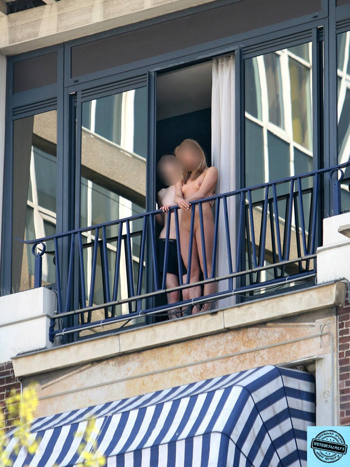 Nude girl on the balcony