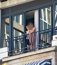 Nude girl on the balcony