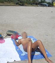 Woman tans in topless