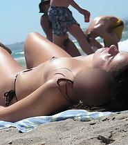 Pointy topless tits on beach