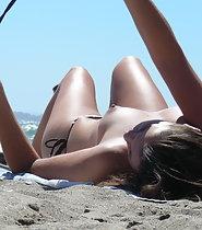 Pointy topless tits on beach