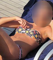 Closeup of hot girl by the swimming pool