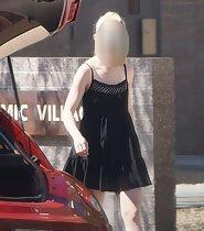 Ass peeks from short black dress