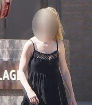 Ass peeks from short black dress