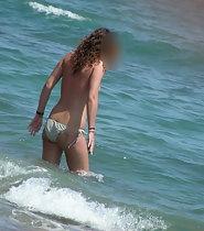 Spying on topless beauty on beach