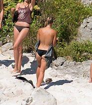 Stunning beach girl likes being topless