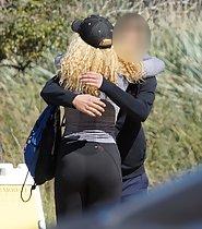 Sexy girl in tights hugs a friend