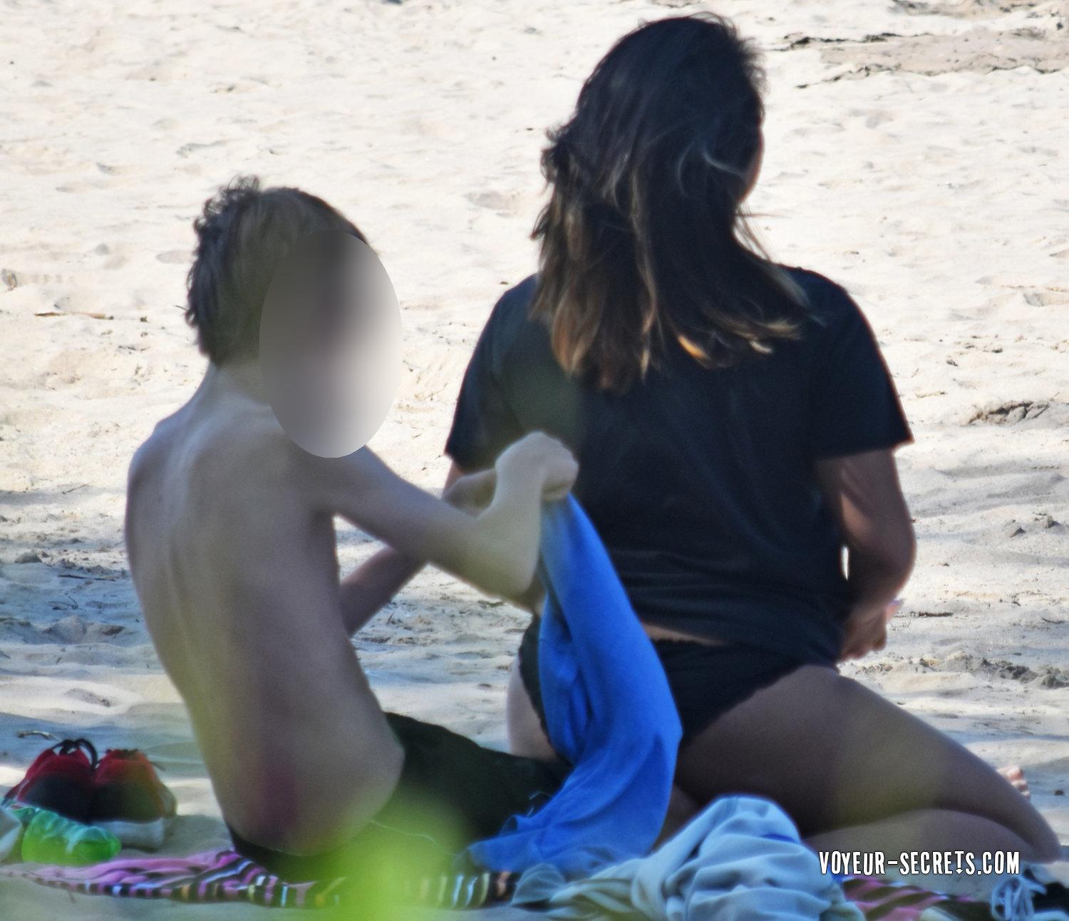 Peeping on boy with horny girl on beach picture image