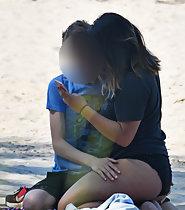 Peeping on boy with horny girl on beach