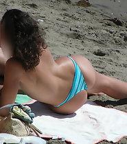 Curly topless girl on beach