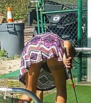 Hot upskirt on mini golf court