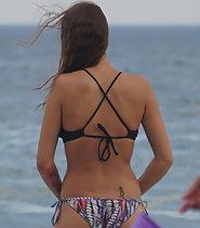 Beach hottie fixes her bikini
