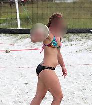 Hot girl plays beach volleyball