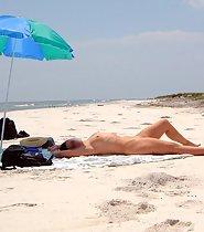 Naked milf on a beach