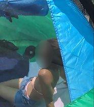 Peeping a cute girl in the beach tent