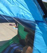 Peeping a cute girl in the beach tent