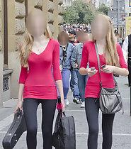 Skinny twin sisters in matching outfits