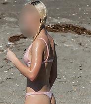 Stunning girl in thong bikini caught by beach voyeur