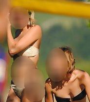 Beach girl's cameltoe in beige bikini