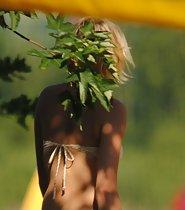 Beach girl's cameltoe in beige bikini