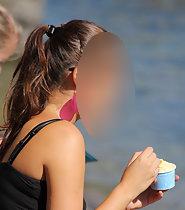 Gorgeous girl licks ice cream
