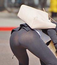 Stunning blonde bends over in tights
