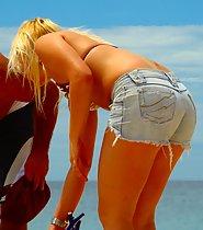 Sexy blonde tugs her bikini thong