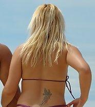 Sexy blonde tugs her bikini thong