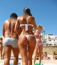 Amazing beach girl in white thong bikini