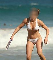 Woman plays on a beach