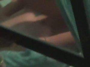 Peeping on a teen girl through a window Picture 7