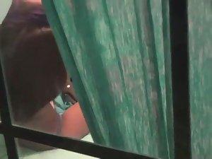 Peeping on a teen girl through a window Picture 8