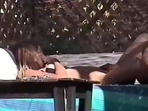 Spy a hot woman with a dildo by the pool Picture 4