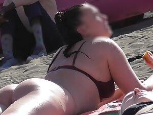 Beach voyeur checks out a big booty in a bikini thong Picture 6