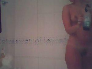 Attractive teen girl spied in the shower Picture 7