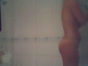 Attractive teen girl spied in the shower Picture 8